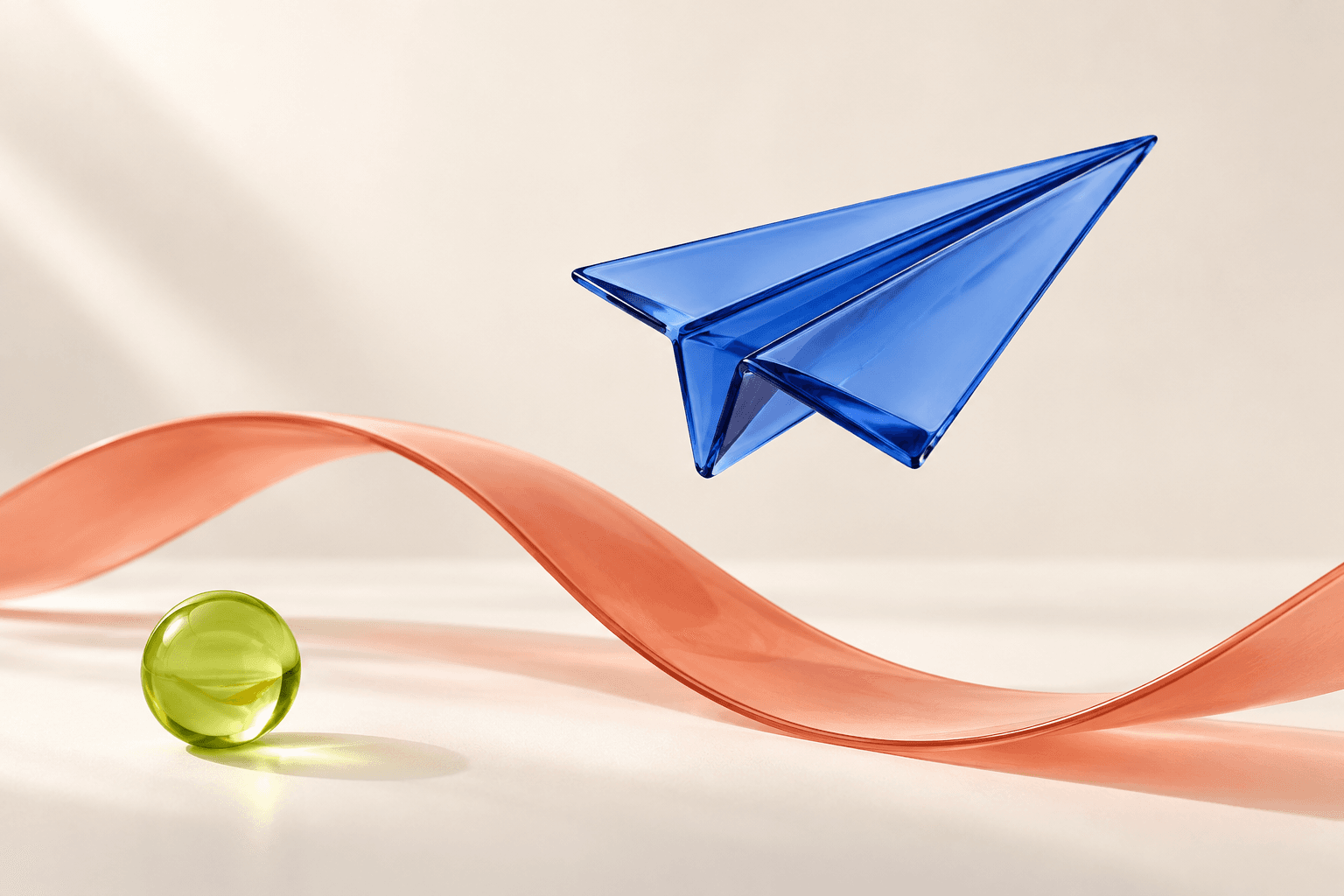 Cobalt glass paper plane floating above a coral ribbon and lime sphere